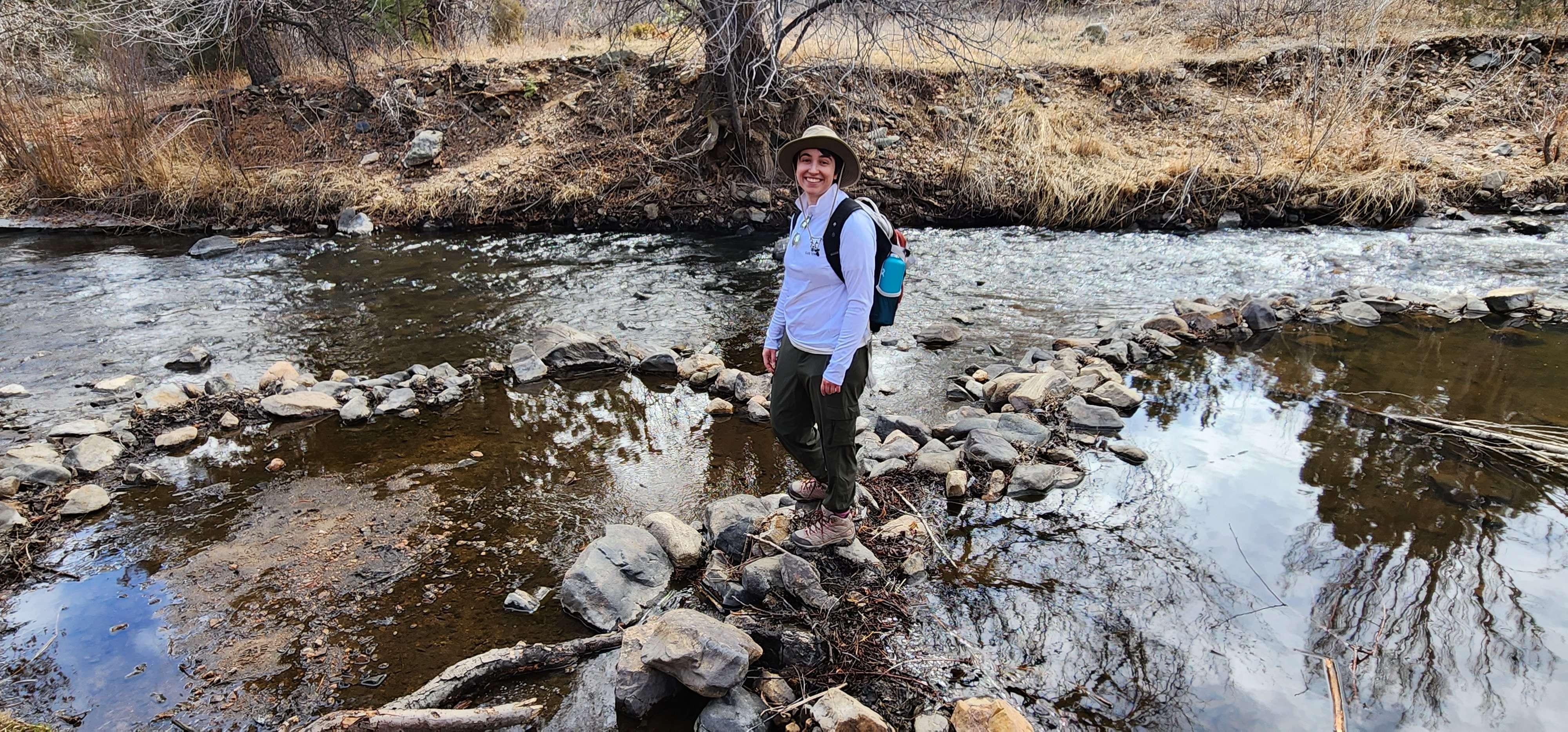 Rachel hiking by stream